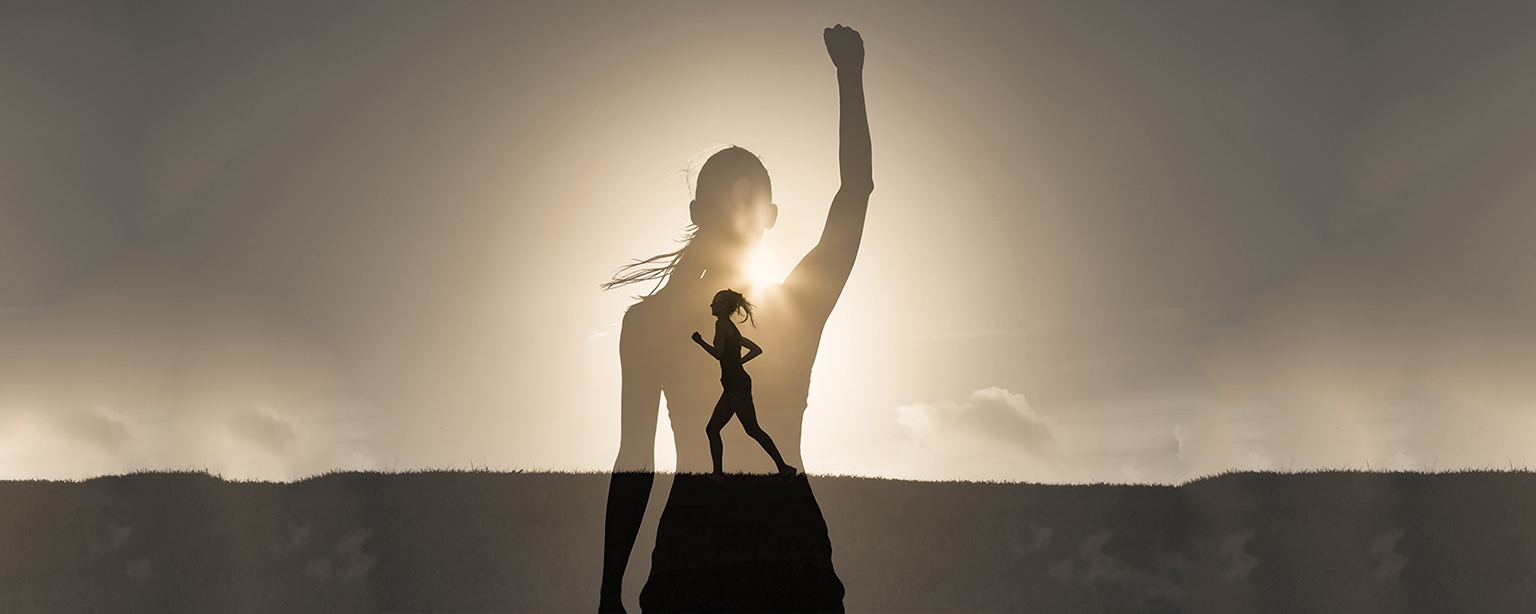 Silhouette of victorious woman and small runner.