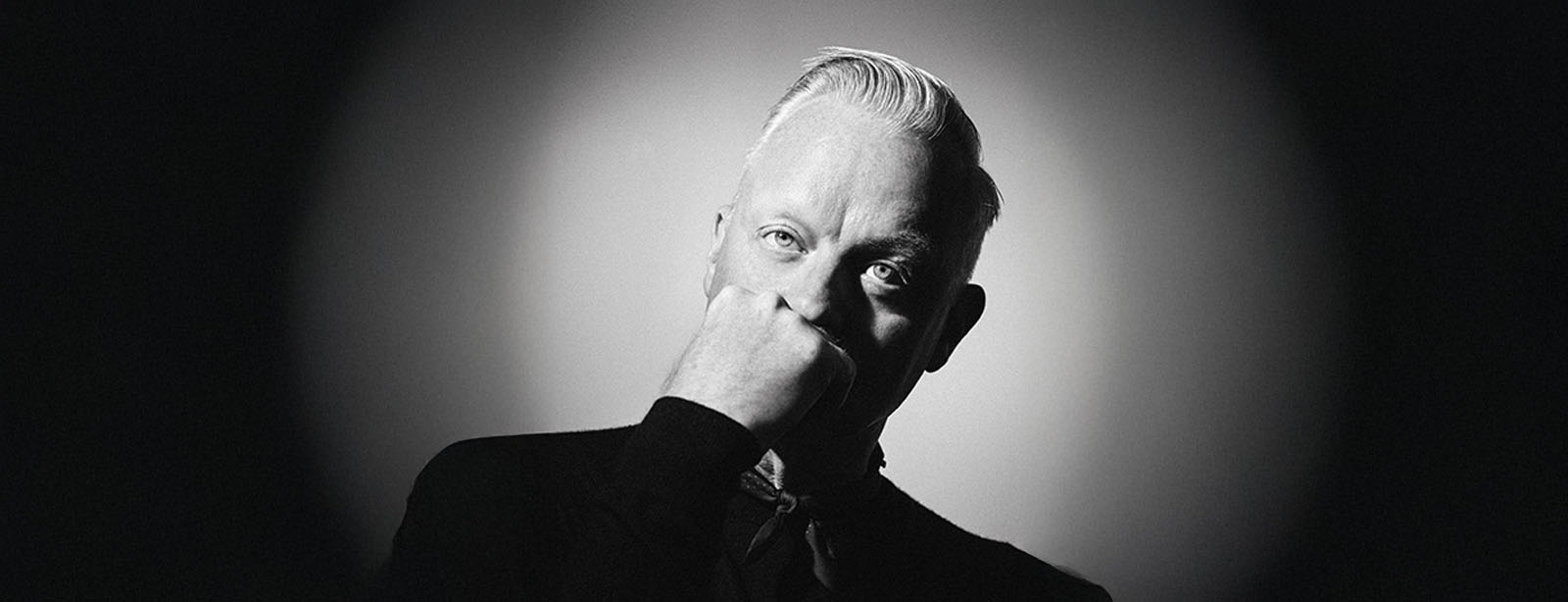 Man contemplating portrait