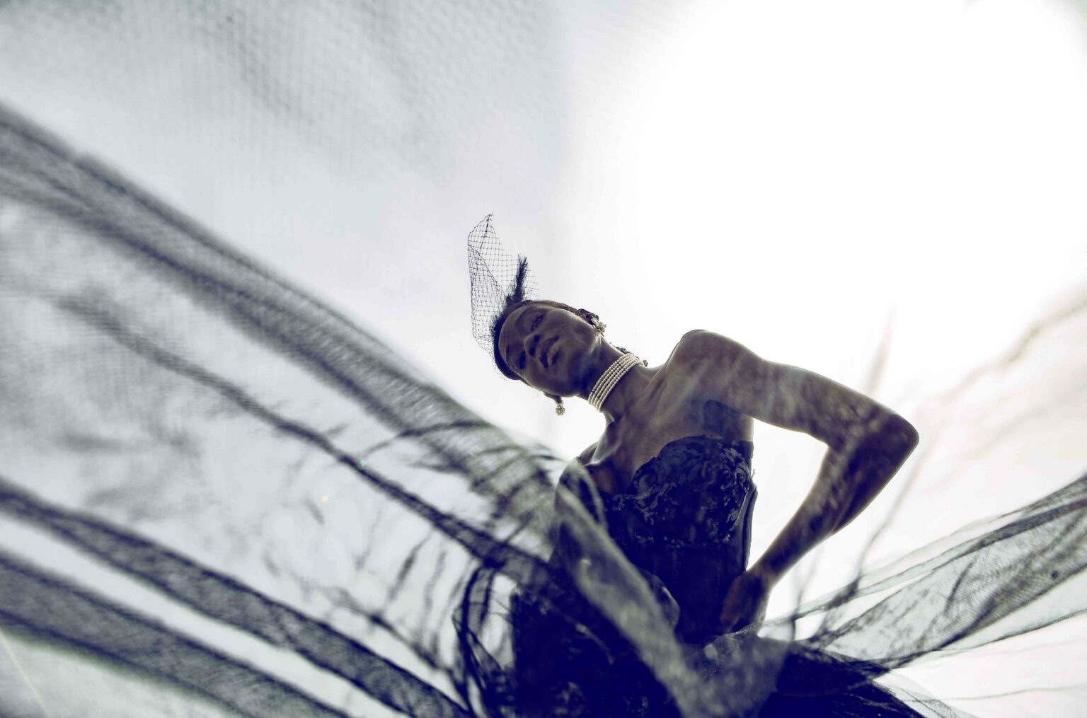 Model posing in fashion silhouette