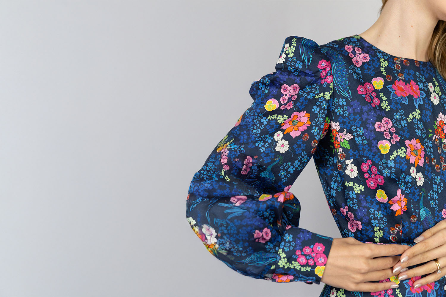 Woman in colorful floral dress.