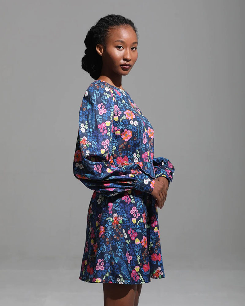 Woman in colorful floral dress.