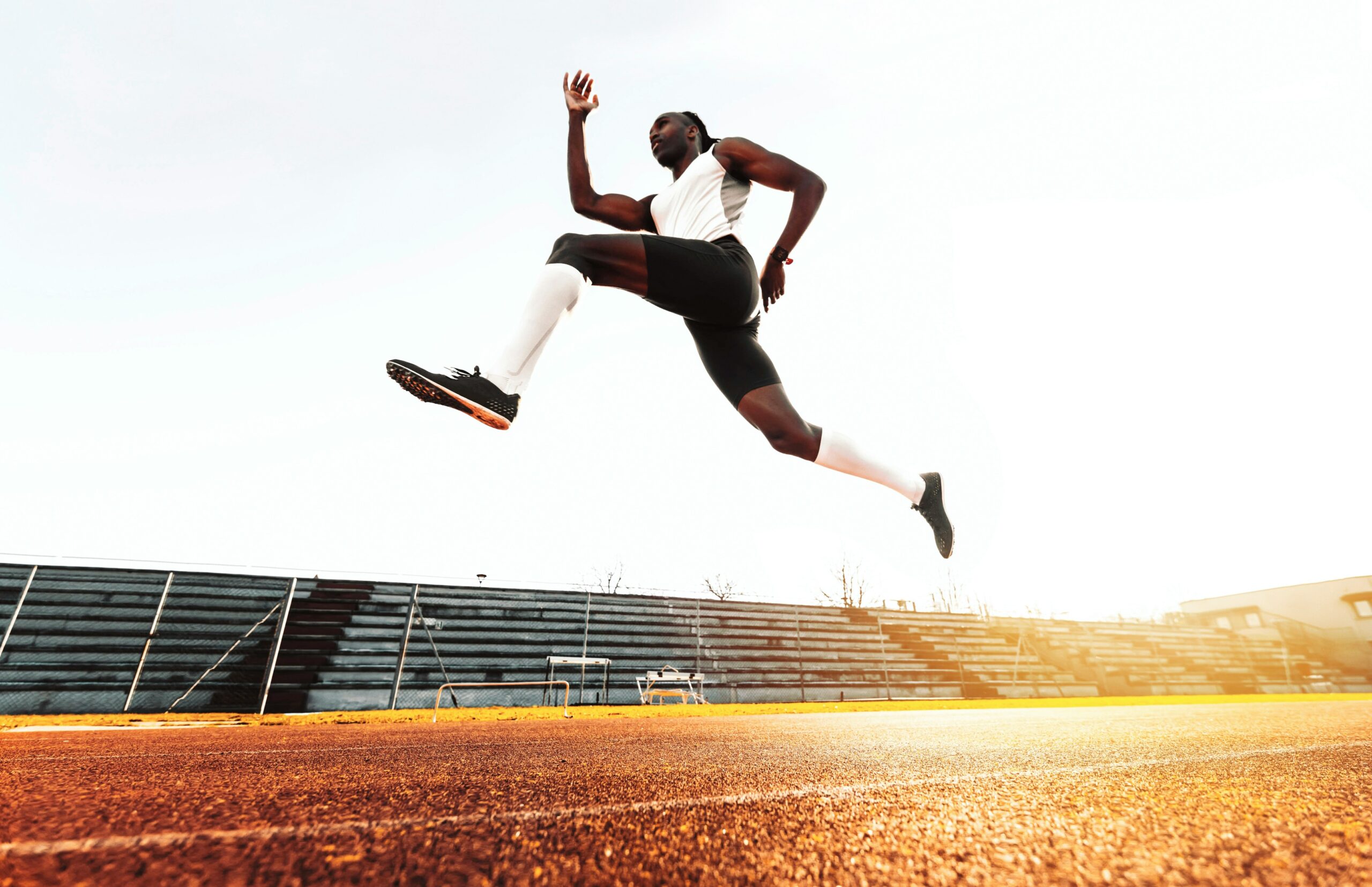 A Black sprinter doing training drills.