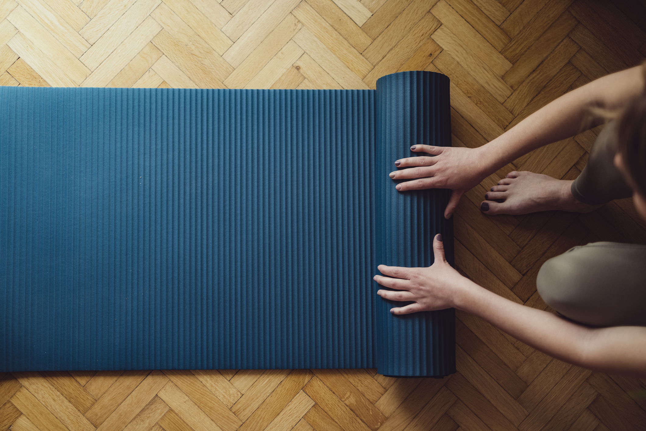 Folding fitness mat after Yoga Practice