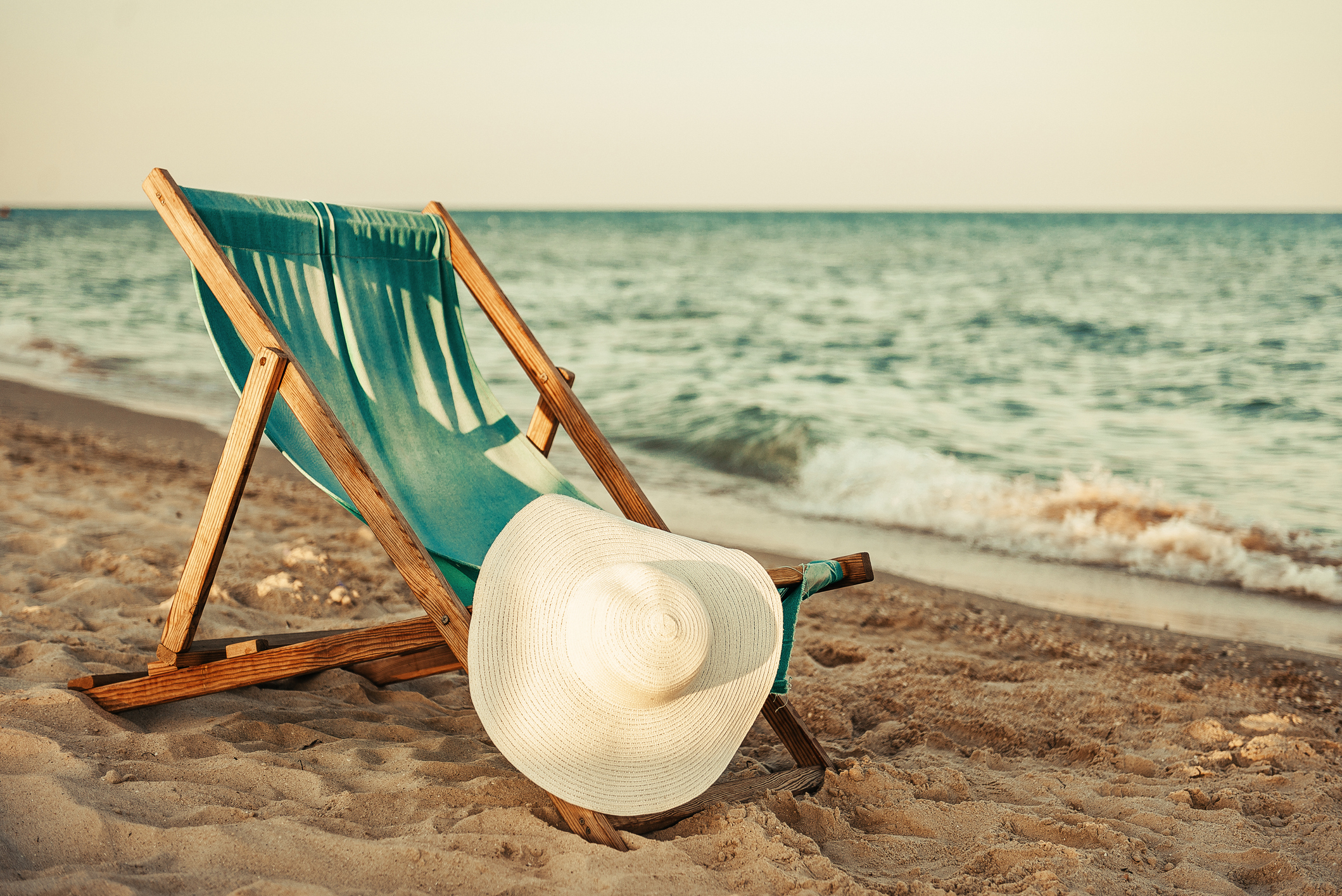 Adults lounging on the beach, embracing a tropical getaway