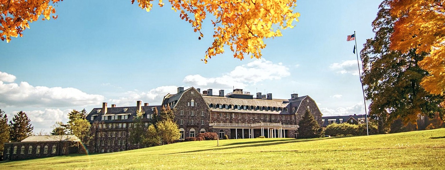 Historic Skytop Lodge surrounded by autumn trees