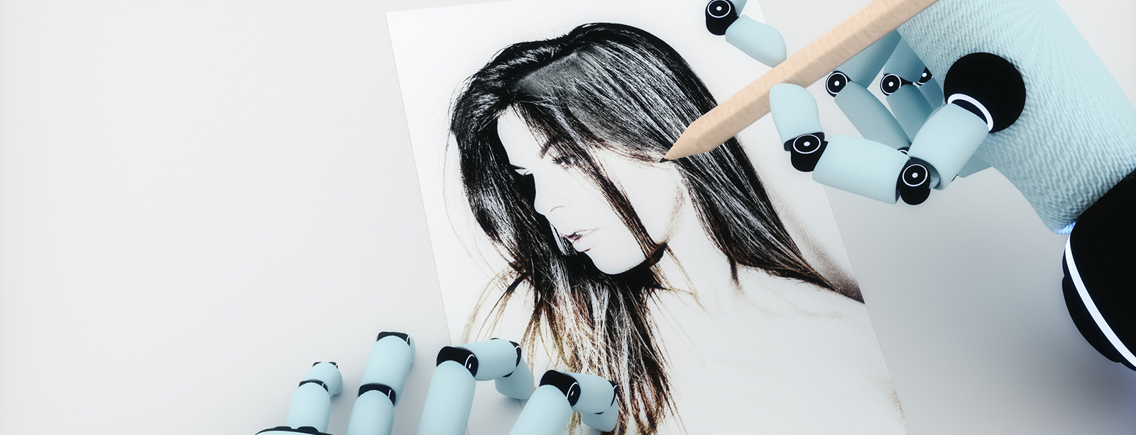 Robotic hands sketching a woman's portrait.