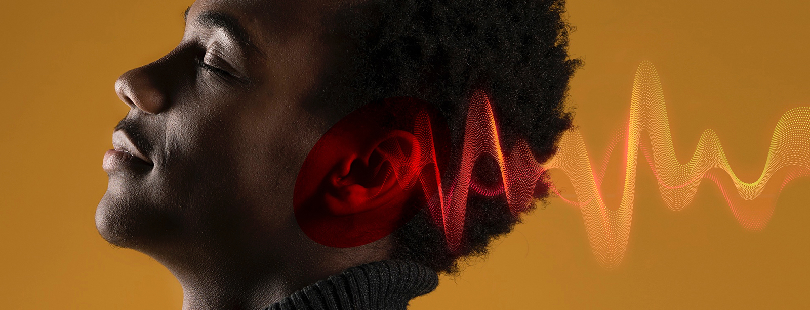 Man listening to music with glowing sound waves.