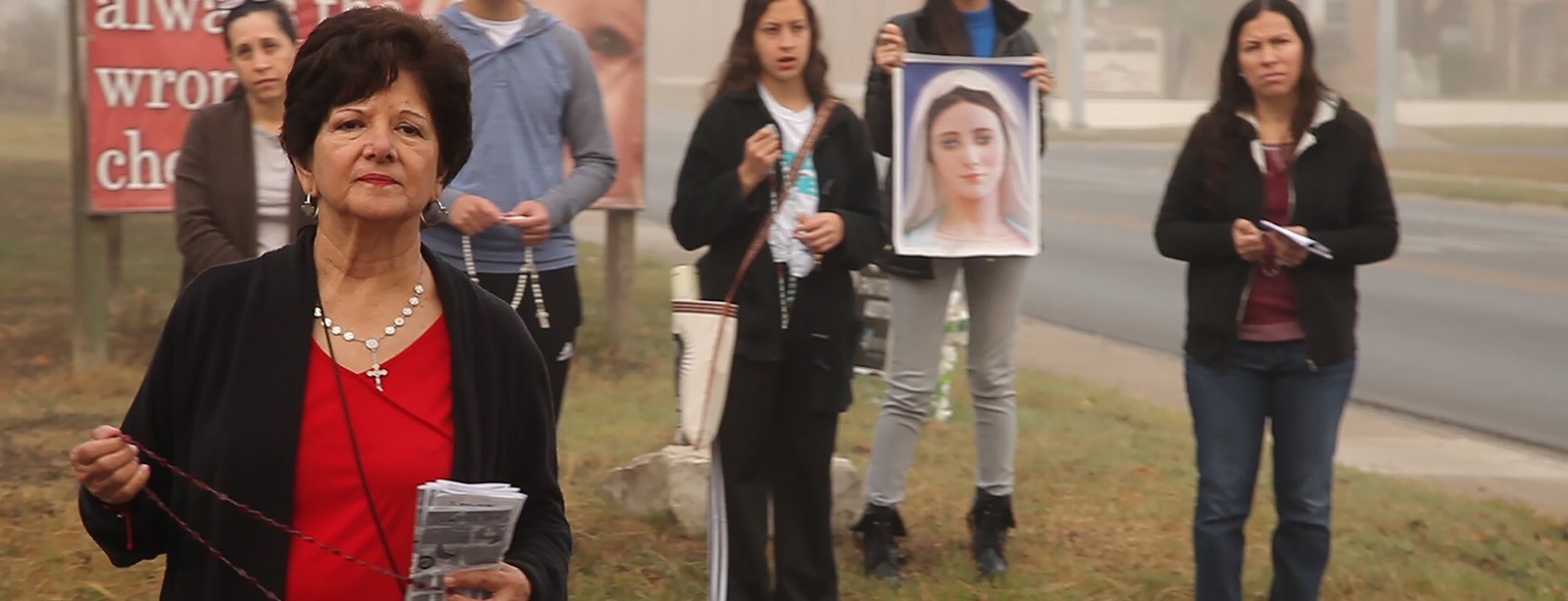 Maya Cueva filming protest scene.