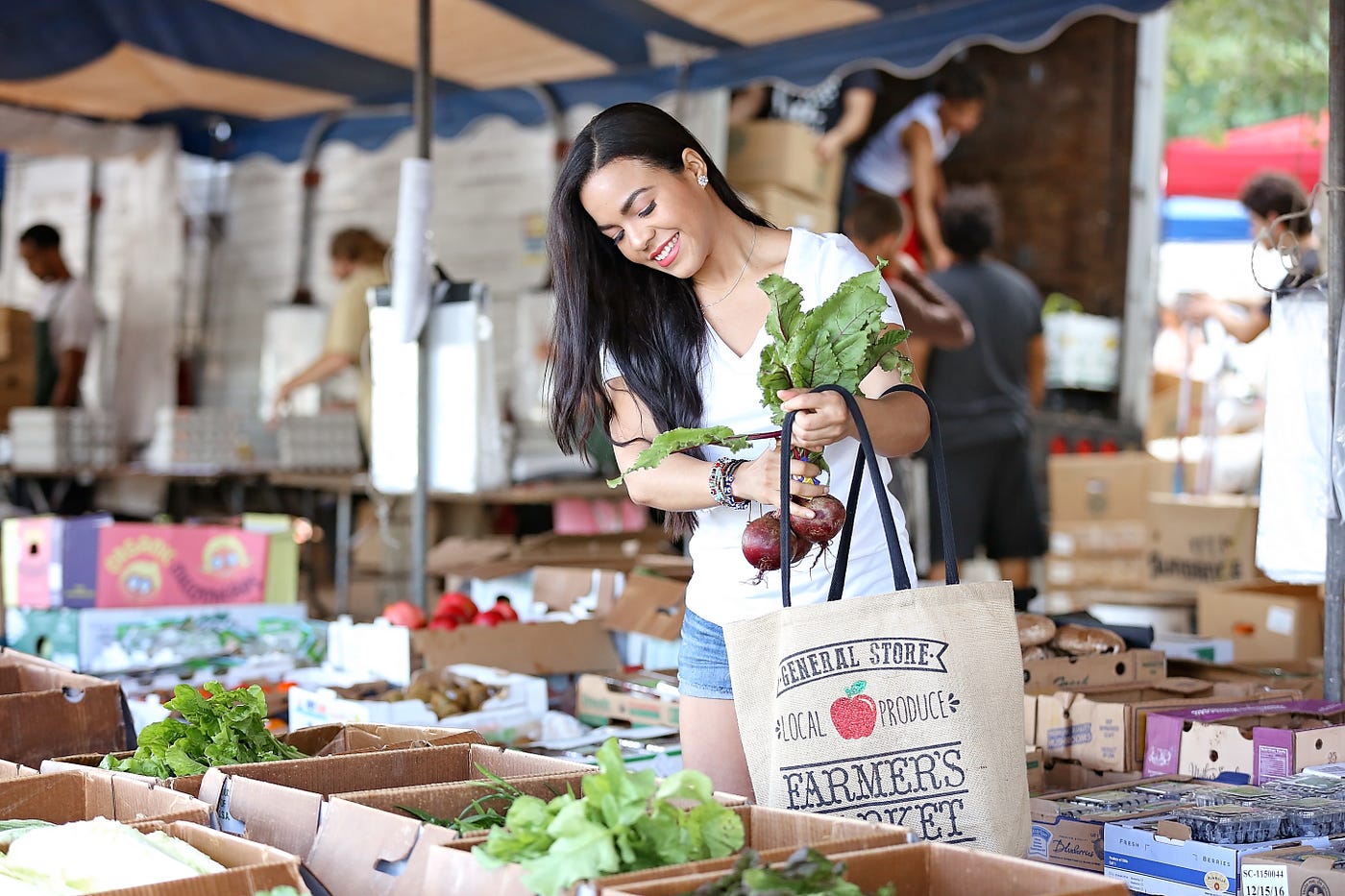 Candy Calderon shopping for fresh produce at a market.