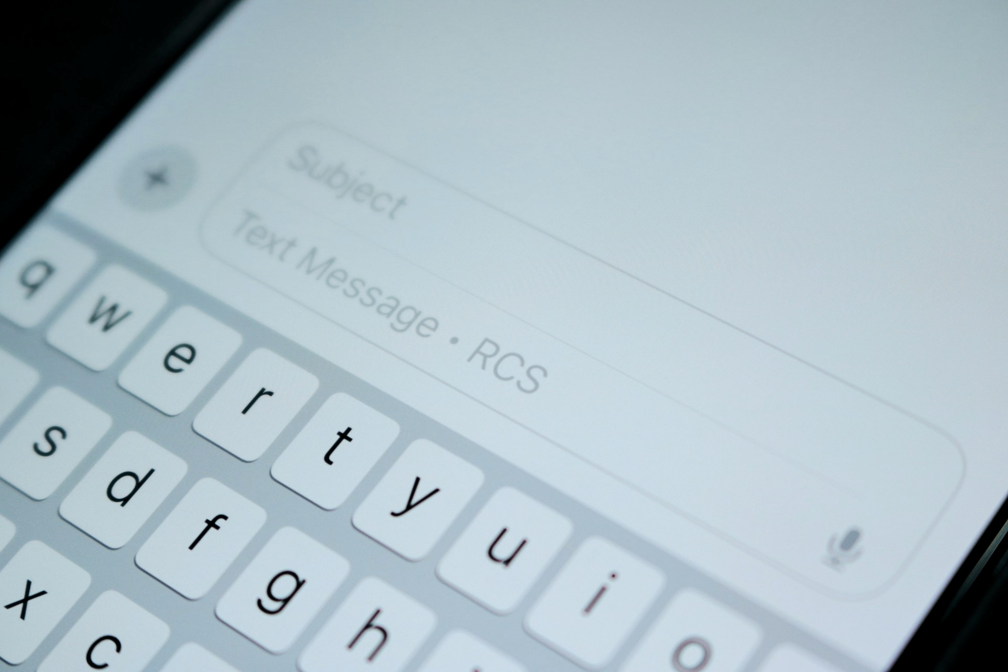Close-up of typing a text message on smartphone