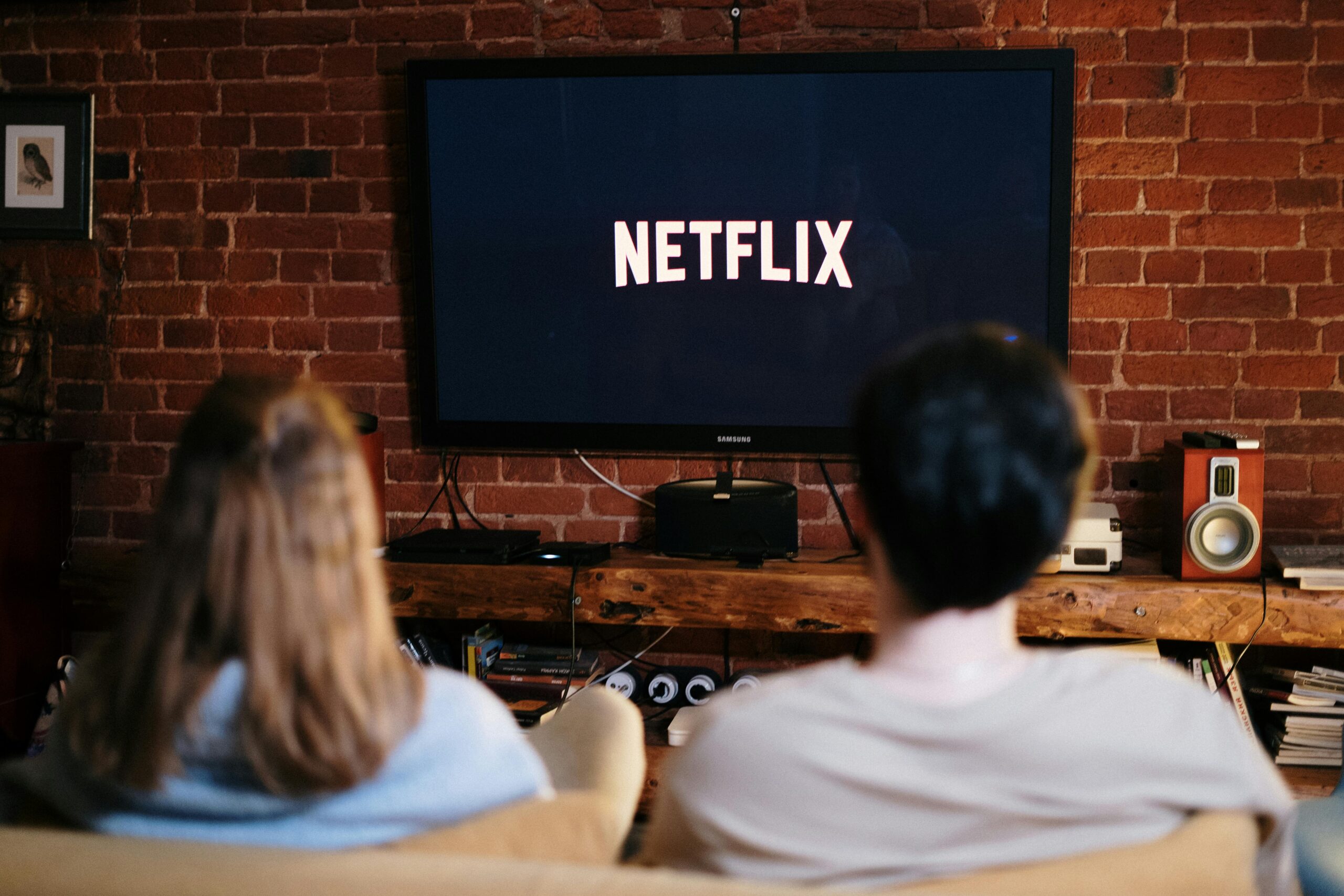 Couple watching Netflix on television at home