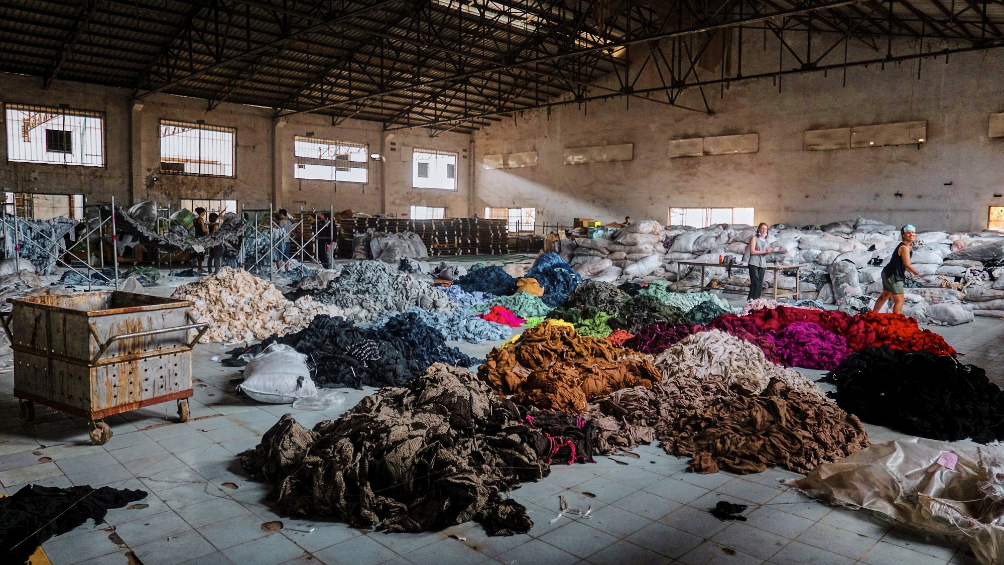 Large warehouse filled with big textile piles