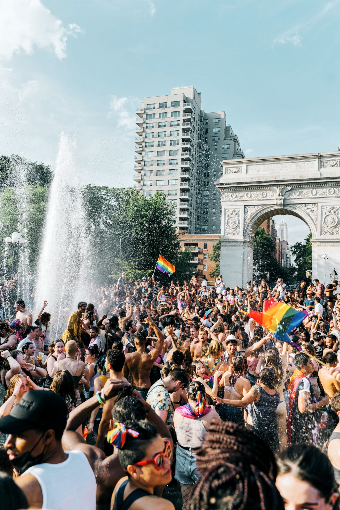 Large crowd gathered around a water fountain