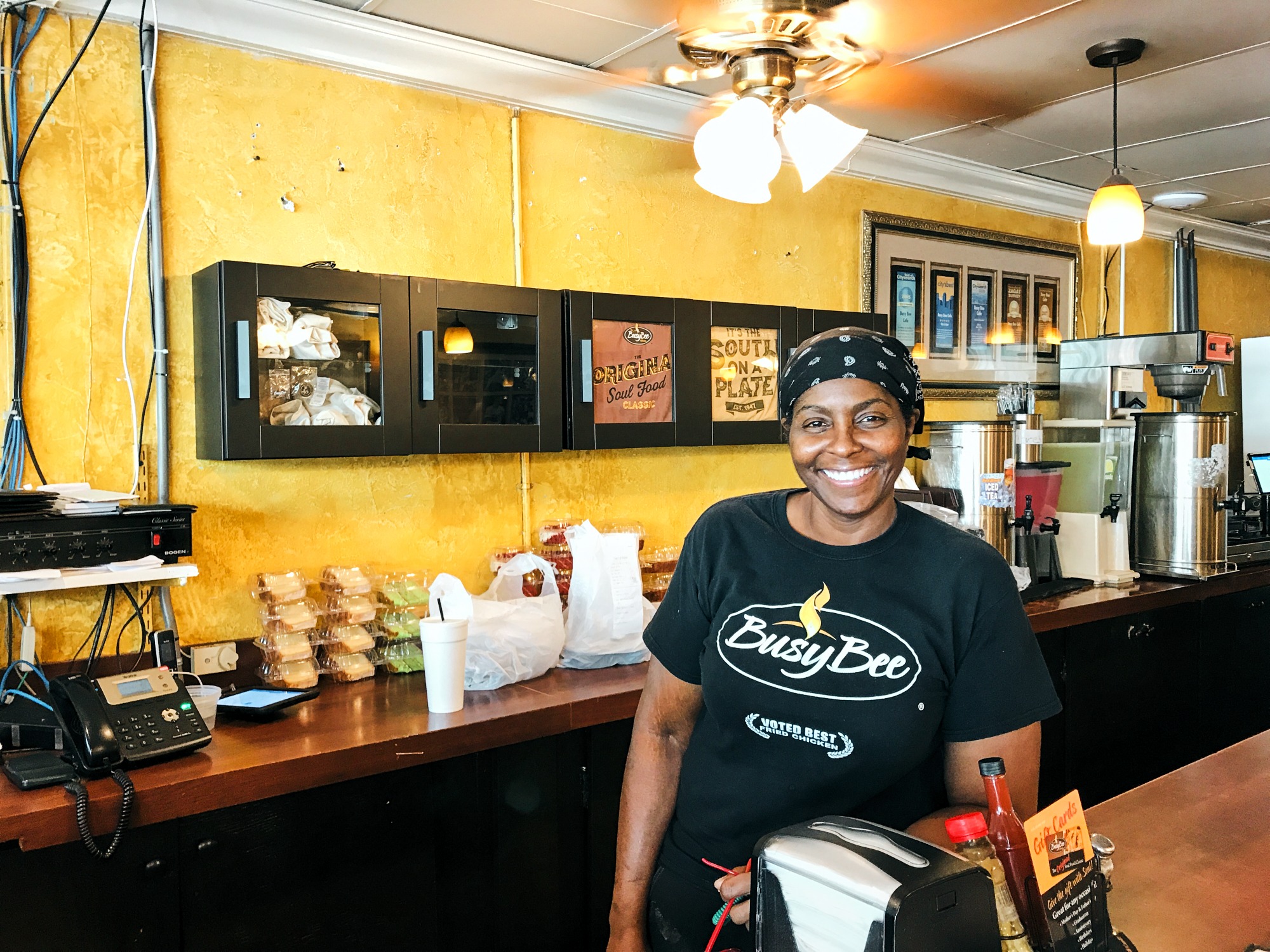 Smiling inside yellow-walled diner