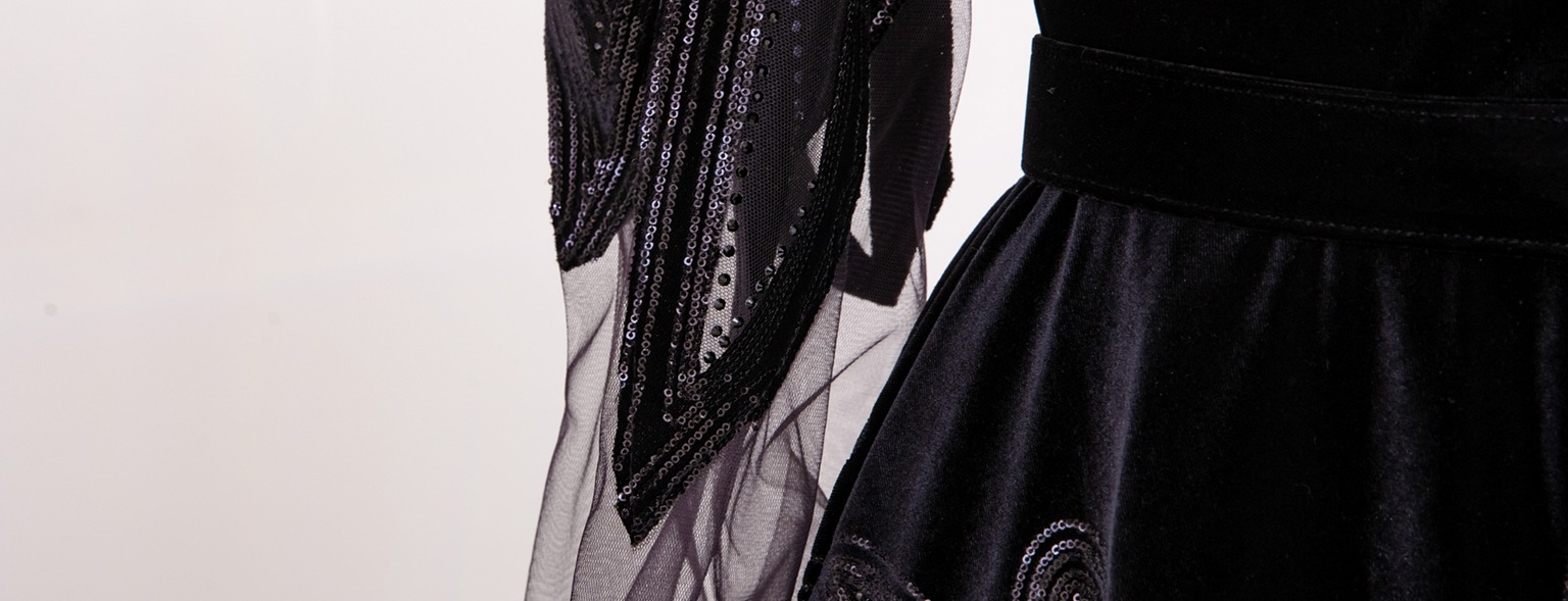 Dark flowing fabric on a simple background