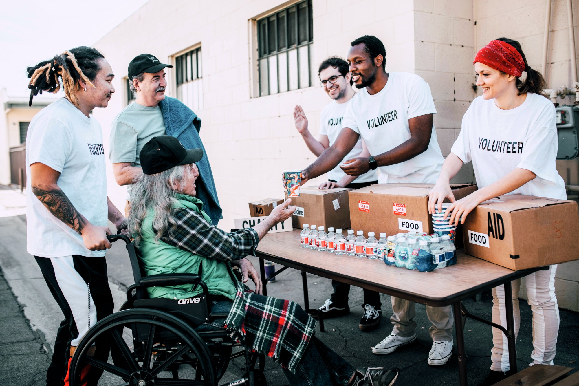 Volunteers distributing aid to people in need