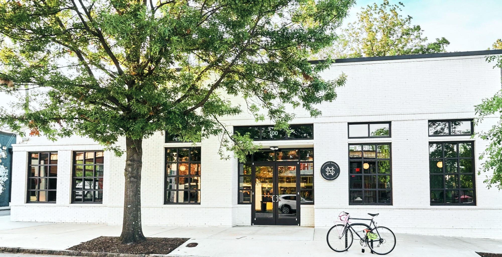 White restaurant building with large glass windows